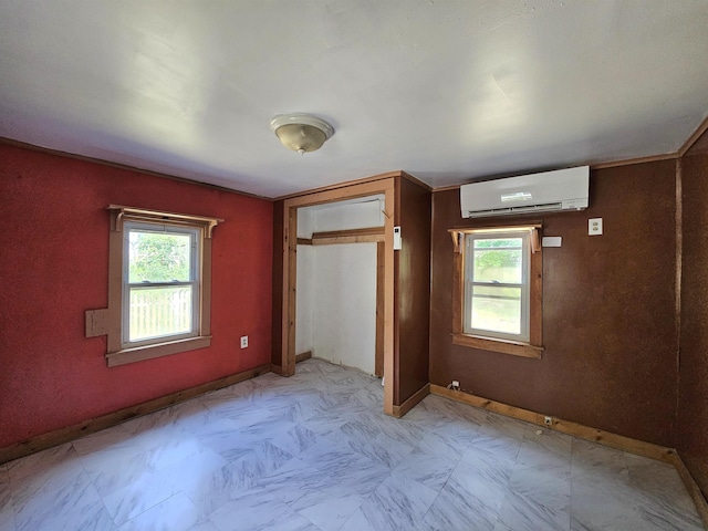 42 Upper Knight St, Keene, NH 03431 - unfurnished bedroom featuring a wall unit AC, multiple windows, a closet, and light floors