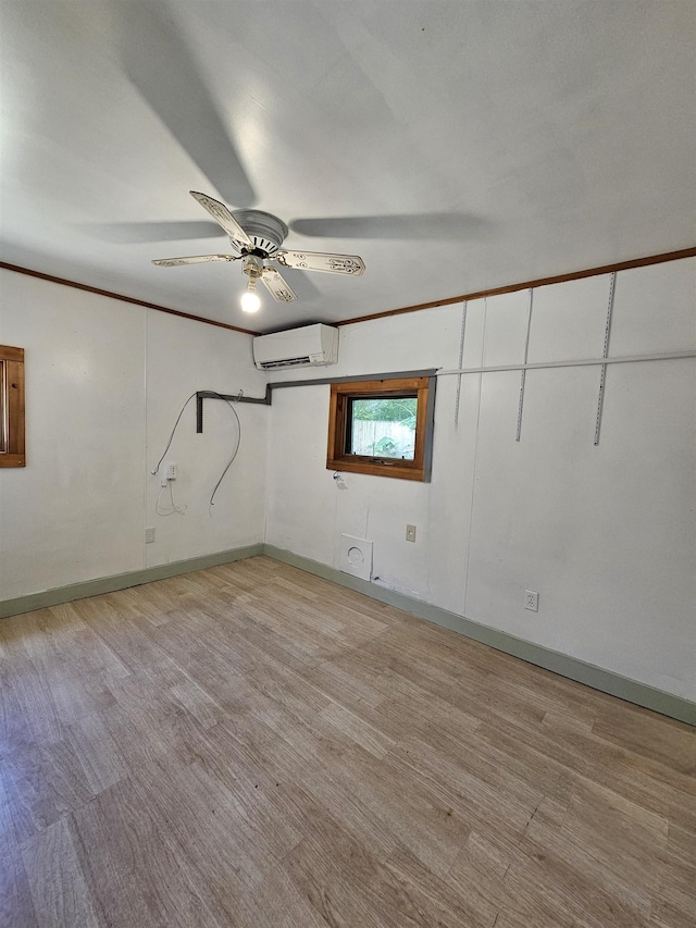 42 Upper Knight St, Keene, NH 03431 - basement with an AC wall unit, a ceiling fan, and light wood-type flooring