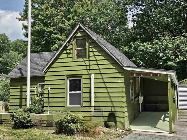 42 Upper Knight St, Keene, NH 03431 - view of side of property with a shingled roof