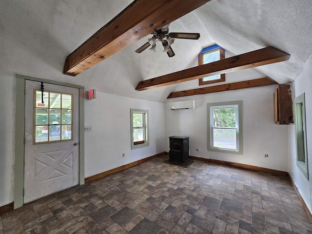 42 Upper Knight St, Keene, NH 03431 - unfurnished living room with a wood stove, an AC wall unit, healthy amount of natural light, a textured ceiling, and a ceiling fan