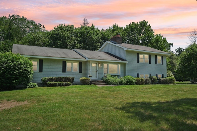 20 Meadow Ln, Atkinson, NH 03811 - split level home with a chimney and a yard