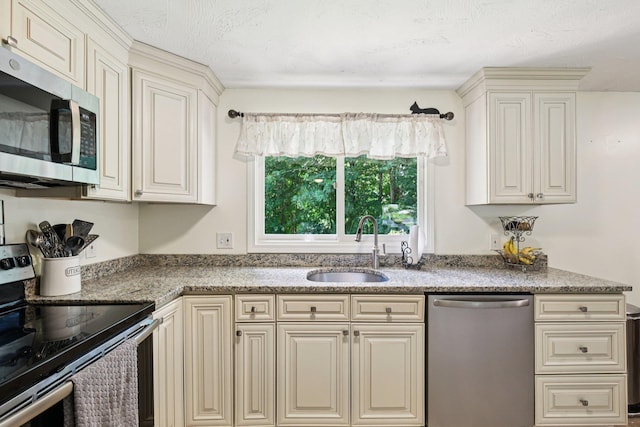 20 Meadow Ln, Atkinson, NH 03811 - kitchen featuring stainless steel appliances, cream cabinetry, and light stone counters