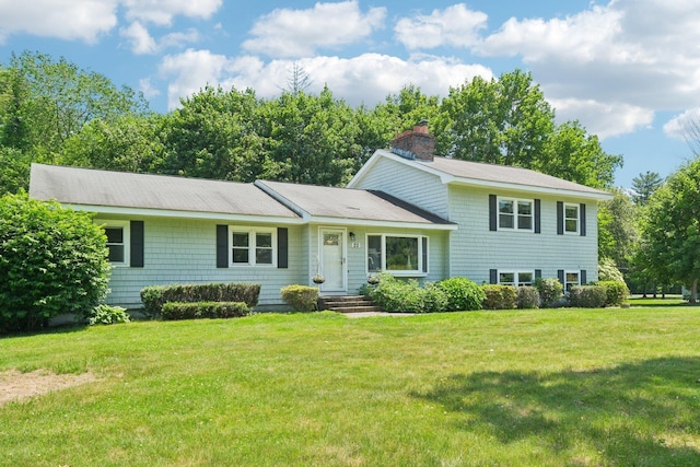 20 Meadow Ln, Atkinson, NH 03811 - tri-level home with a chimney and a front lawn