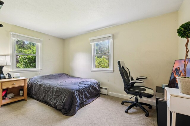 20 Meadow Ln, Atkinson, NH 03811 - carpeted bedroom featuring a baseboard heating unit and an office area