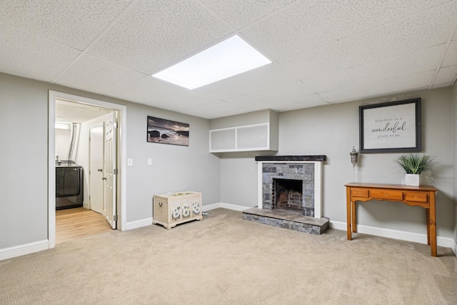 20 Meadow Ln, Atkinson, NH 03811 - unfurnished living room featuring carpet, washer / dryer, a fireplace, and a paneled ceiling