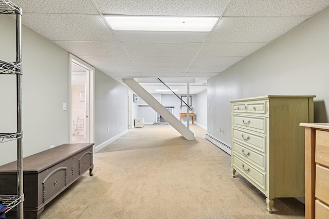 20 Meadow Ln, Atkinson, NH 03811 - finished basement featuring a baseboard radiator, light carpet, stairs, and a paneled ceiling