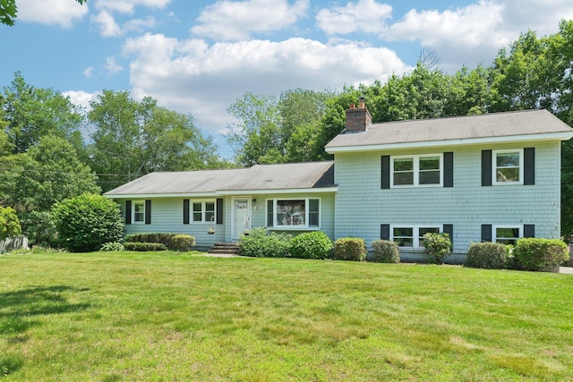 20 Meadow Ln, Atkinson, NH 03811 - tri-level home featuring a chimney and a front yard
