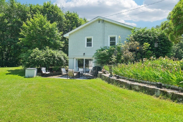 20 Meadow Ln, Atkinson, NH 03811 - rear view of property featuring a patio, a lawn, and an outdoor hangout area