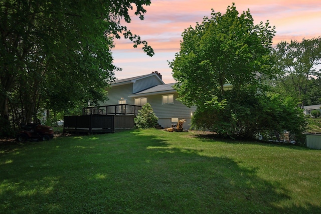 20 Meadow Ln, Atkinson, NH 03811 - yard at dusk featuring a lawn and a deck