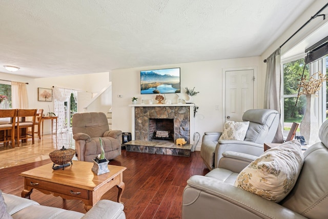 20 Meadow Ln, Atkinson, NH 03811 - living room featuring a stone fireplace and wood finished floors