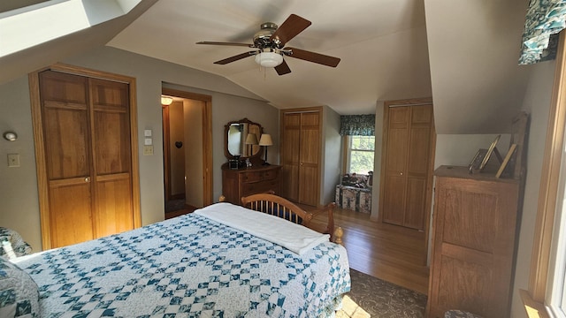 18 Cross St, Allenstown, NH 03275 - bedroom featuring vaulted ceiling, two closets, wood finished floors, and a ceiling fan