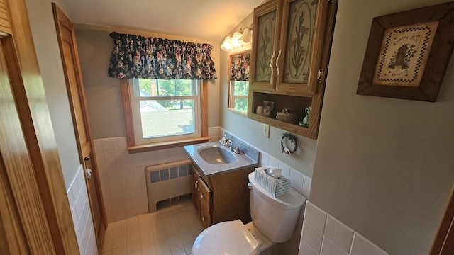 18 Cross St, Allenstown, NH 03275 - half bath featuring radiator heating unit, vanity, tile walls, wainscoting, and tile patterned flooring