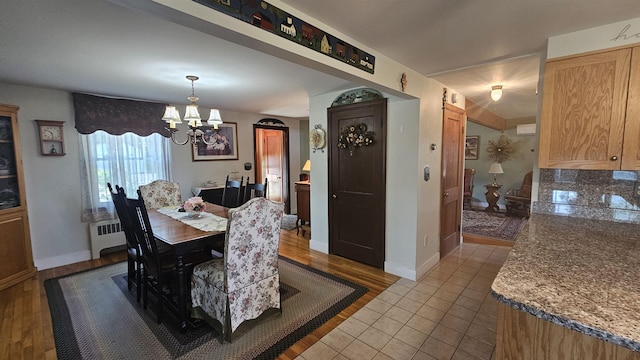 18 Cross St, Allenstown, NH 03275 - tiled dining room with a chandelier and radiator heating unit