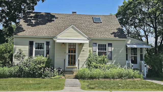 18 Cross St, Allenstown, NH 03275 - view of front of house with roof with shingles and a front yard
