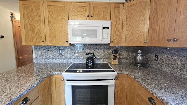 18 Cross St, Allenstown, NH 03275 - kitchen featuring white appliances, tasteful backsplash, and dark stone counters