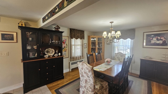 18 Cross St, Allenstown, NH 03275 - dining area featuring radiator, a chandelier, and light wood-style flooring