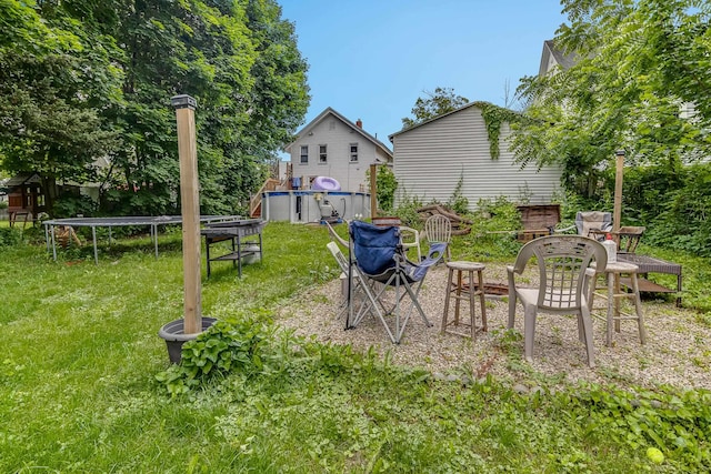 8 Myrtle St, Somersworth, NH 03878 - view of green lawn featuring a trampoline