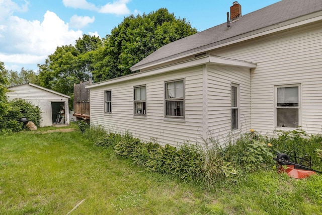 8 Myrtle St, Somersworth, NH 03878 - view of side of home featuring a lawn and a chimney