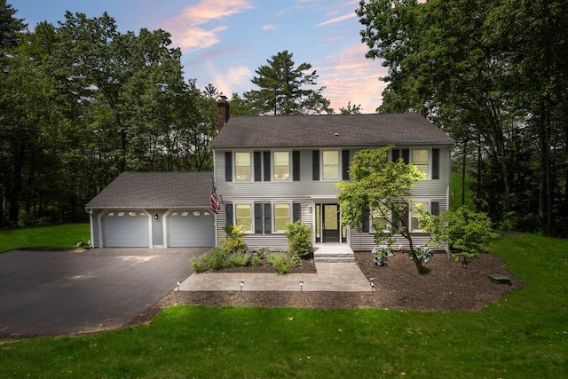 7 Dearborn Ln, Bedford, NH 03110 - colonial home featuring a garage, driveway, a chimney, and a front lawn