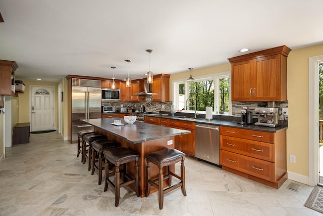 7 Dearborn Ln, Bedford, NH 03110 - kitchen with built in appliances, dark countertops, decorative backsplash, a breakfast bar area, and recessed lighting