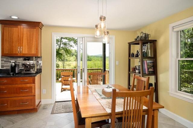 7 Dearborn Ln, Bedford, NH 03110 - dining space with light tile patterned floors and baseboards