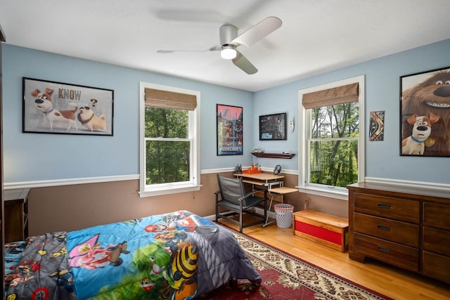 7 Dearborn Ln, Bedford, NH 03110 - bedroom with multiple windows, wood finished floors, and ceiling fan