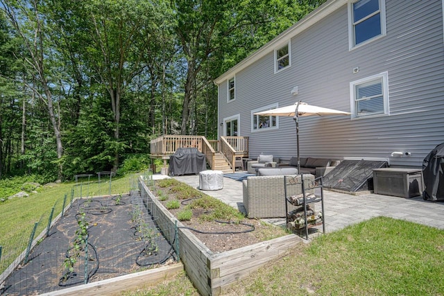 7 Dearborn Ln, Bedford, NH 03110 - view of grassy yard with a garden, a patio, a wooden deck, and an outdoor hangout area