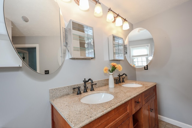 38 Brook Hollow Way, Manchester, NH 03103 - bathroom with double vanity and tile patterned floors
