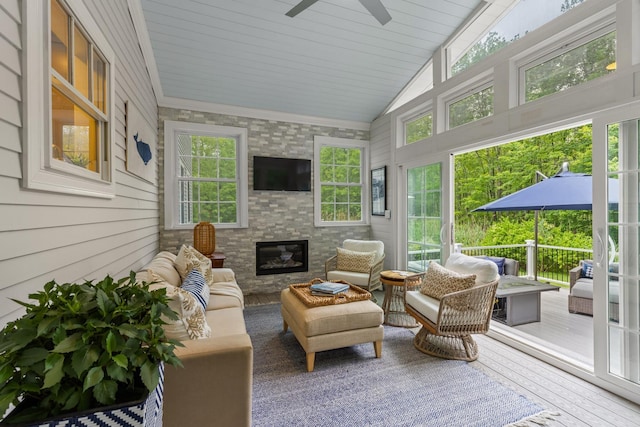 23 Rockrimmon Rd, North Hampton, NH 03862 - sunroom / solarium featuring a ceiling fan, an outdoor living space with a fireplace, and lofted ceiling