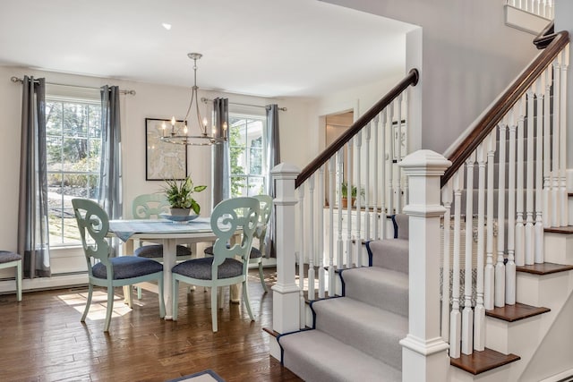 23 Rockrimmon Rd, North Hampton, NH 03862 - dining room with plenty of natural light, hardwood / wood-style floors, stairway, and a chandelier