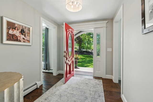 23 Rockrimmon Rd, North Hampton, NH 03862 - entrance foyer with a baseboard heating unit, healthy amount of natural light, a chandelier, and dark wood-type flooring