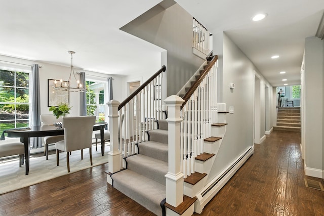 23 Rockrimmon Rd, North Hampton, NH 03862 - stairs with a baseboard heating unit, wood-type flooring, healthy amount of natural light, recessed lighting, and a chandelier