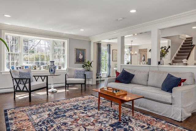 23 Rockrimmon Rd, North Hampton, NH 03862 - living room with crown molding, hardwood / wood-style floors, a chandelier, recessed lighting, and a baseboard radiator