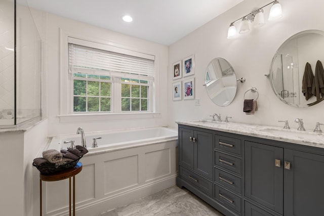 23 Rockrimmon Rd, North Hampton, NH 03862 - full bathroom with a garden tub, double vanity, and a shower