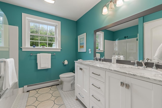 23 Rockrimmon Rd, North Hampton, NH 03862 - full bath with a baseboard radiator, a shower with door, and double vanity