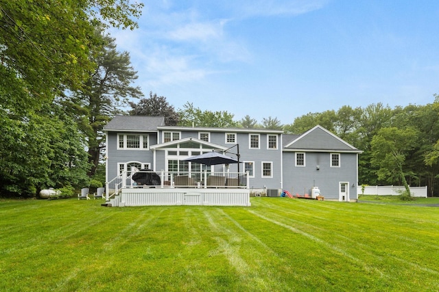 23 Rockrimmon Rd, North Hampton, NH 03862 - rear view of house featuring a wooden deck and a yard
