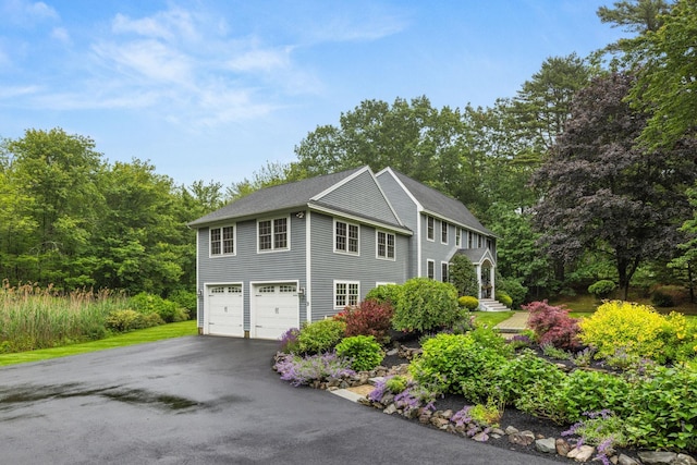 23 Rockrimmon Rd, North Hampton, NH 03862 - view of property exterior with asphalt driveway and a garage
