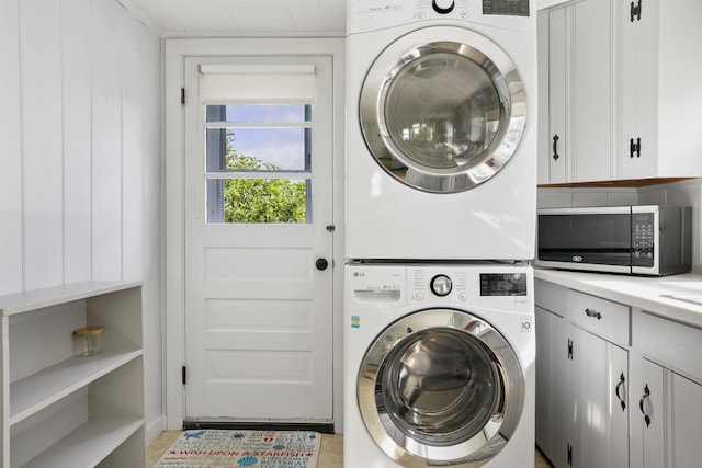 8 Red Coat Ln, Hampton, NH 03842 - washroom featuring stacked washer / drying machine and cabinet space
