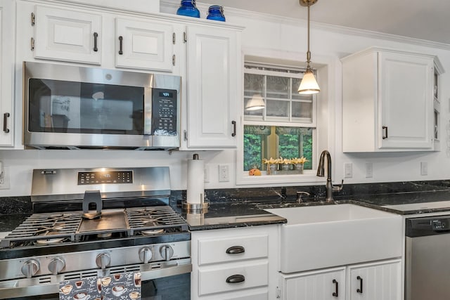 638 Benton Dr, Laconia, NH 03246 - kitchen with appliances with stainless steel finishes, white cabinets, crown molding, dark stone counters, and pendant lighting
