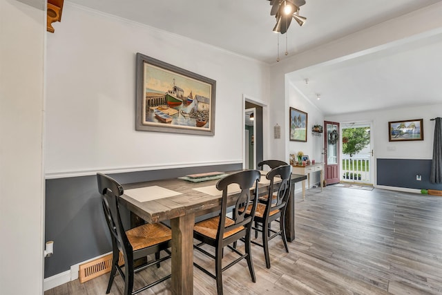 638 Benton Dr, Laconia, NH 03246 - dining area featuring ceiling fan, light wood-type flooring, lofted ceiling, and crown molding