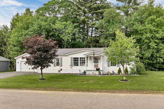 638 Benton Dr, Laconia, NH 03246 - view of front of home featuring asphalt driveway, covered porch, a front yard, and a metal roof