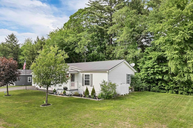 638 Benton Dr, Laconia, NH 03246 - view of front of property featuring a front yard and a metal roof