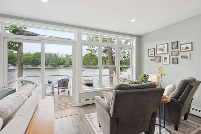 161 Micah Ter, Milton, NH 03851 - living room featuring a water view, healthy amount of natural light, recessed lighting, light wood-style flooring, and baseboard heating