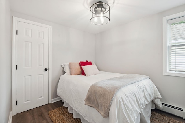 161 Micah Ter, Milton, NH 03851 - bedroom featuring baseboard heating and wood finished floors