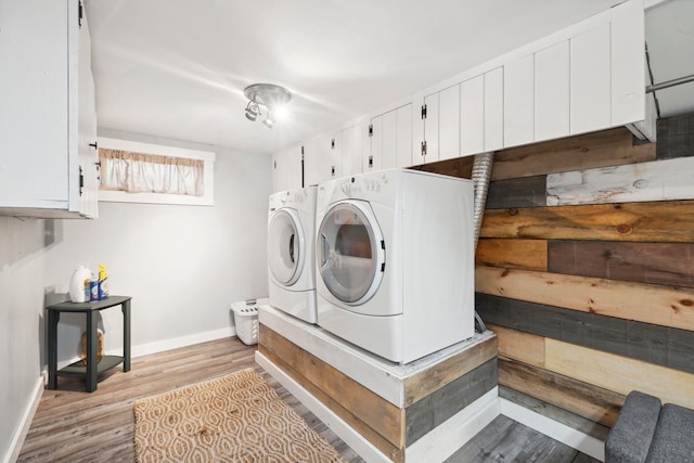 161 Micah Ter, Milton, NH 03851 - washroom with separate washer and dryer, wood finished floors, and cabinet space