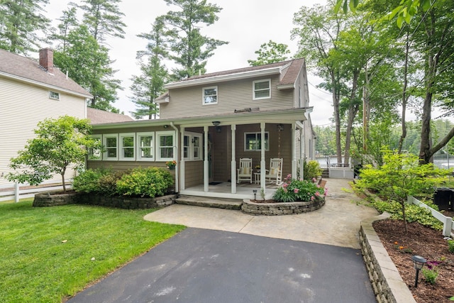 161 Micah Ter, Milton, NH 03851 - view of front of house with covered porch and a front yard