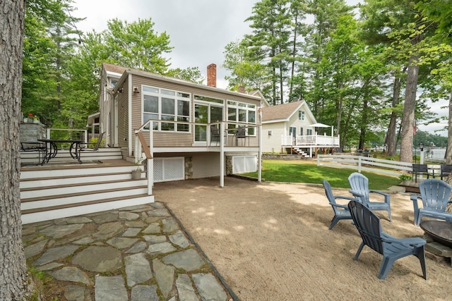 161 Micah Ter, Milton, NH 03851 - back of house with a chimney, a patio, a deck, and stairs