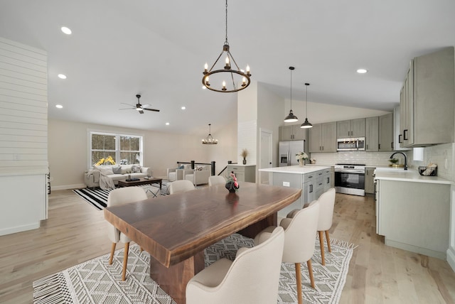 172 Tasker Hill Rd, Strafford, NH 03884 - dining room featuring a chandelier, ceiling fan, light wood-type flooring, recessed lighting, and high vaulted ceiling
