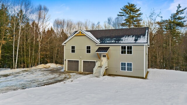172 Tasker Hill Rd, Strafford, NH 03884 - view of front of home featuring an attached garage, a standing seam roof, and a metal roof