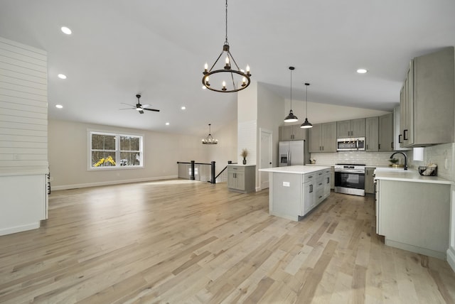 172 Tasker Hill Rd, Strafford, NH 03884 - kitchen featuring stainless steel appliances, a chandelier, gray cabinetry, a kitchen island, and ceiling fan